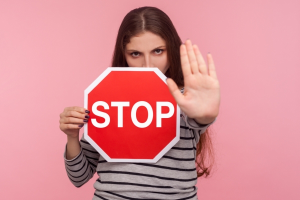 woman stop sign